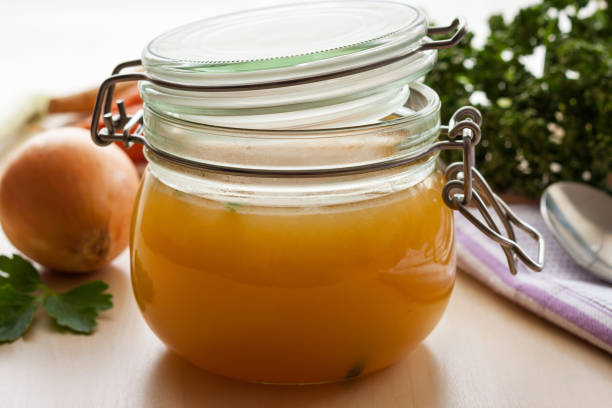 istock Chicken bone broth in a glass jar 918255310