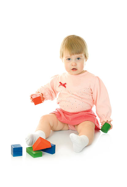 istock Small baby with a toy pyramid isolated 91825536