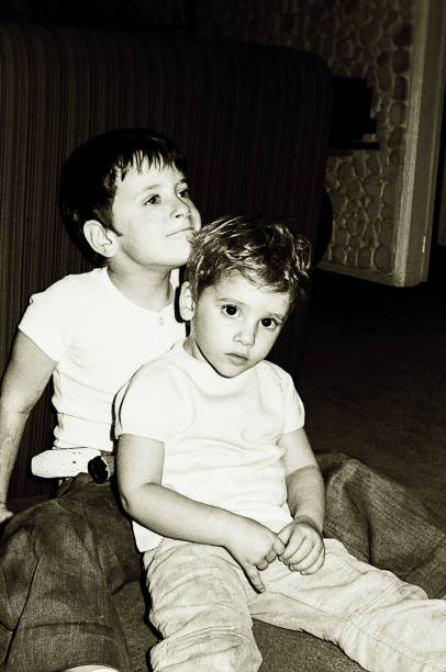 black and white kids sitting on floor at home - 20th century style flash imagens e fotografias de stock