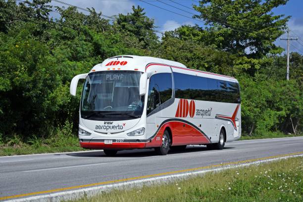 Cancun, Mexico - 11 January, 2018: Irizar i6 coach bus driving on the road. Irizar is a manufacturer of passenger transport vehicles (coachbuilder) from Spain. Today Irizar is a popular bus brand in Central America.
