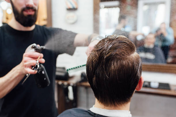istock man getting trendy haircut at barber shop. 918256688