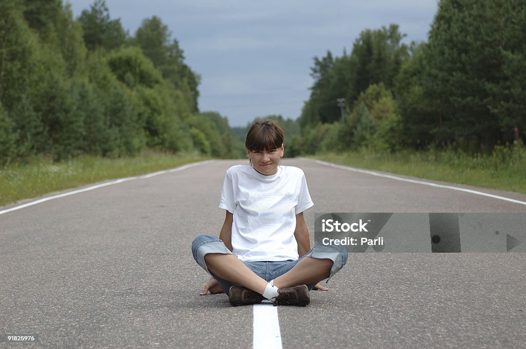 Girl sitting on road  Adult Stock Photo