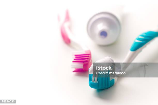 Pink And Blue Toothbrushes And Toothpaste Tube Stock Photo - Download Image Now - Blue, Brushing, Clean