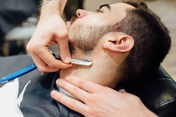 istock Barber shave and modeling beard at the hair salon 918262756