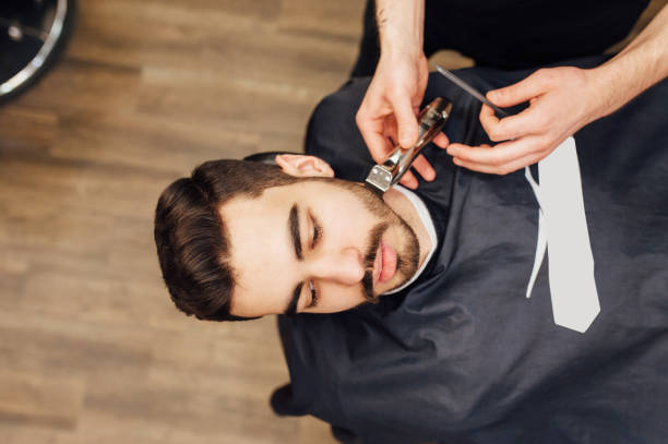 istock Barber shave and modeling beard at the hair salon 918262896
