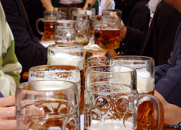 Mugs of beer at Beer Fest in Munich, Germany stock photo