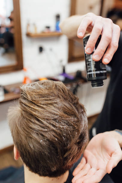istock man is getting hairstyle at barber shop 918265550