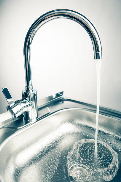 istock kitchen faucet with flowing water 918266032