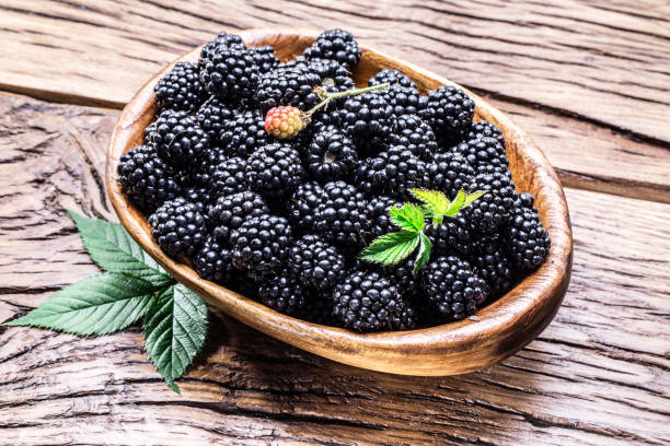 istock Blackberries in the wooden bowl. 918266122