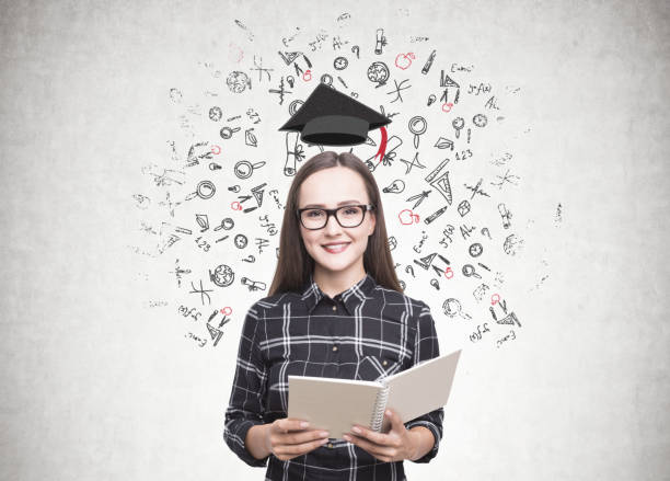 istock Smiling woman in glasses, copybook, education 918266140