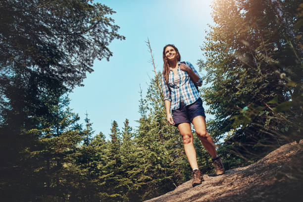 Shot of a young woman going for a hike through nature