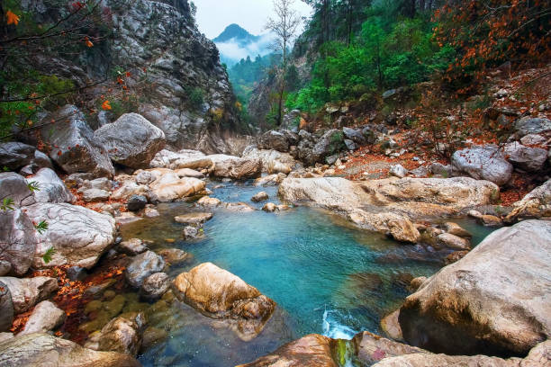 Mountain lake in a narrow gorge. Autumn landscape on a rainy autumn morning. Turkey, UNESCO
