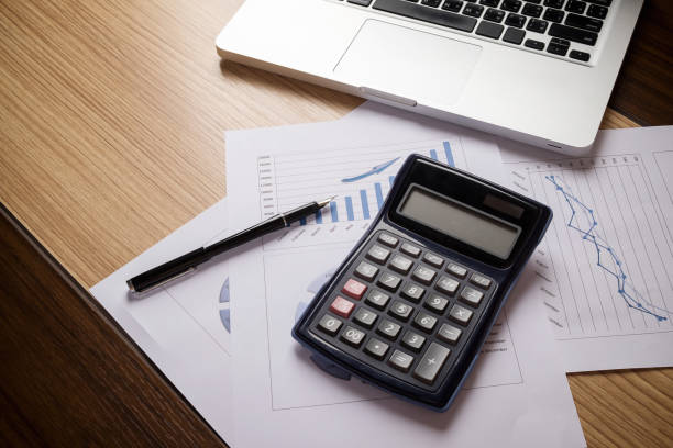 istock Desk office with laptop,taplet, analysis report ,calculator 918267122