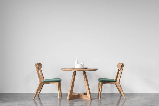 istock Round table and green and wooden chairs 918269364