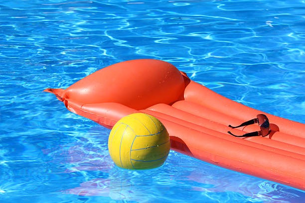 istock air mattress and volleyball in pool 91827154