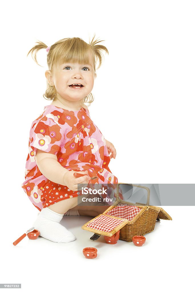 Small smiling baby in red dress with toy basket  Baby - Human Age Stock Photo