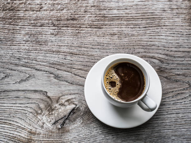 istock Cup of coffee on the wooden table. 918273740