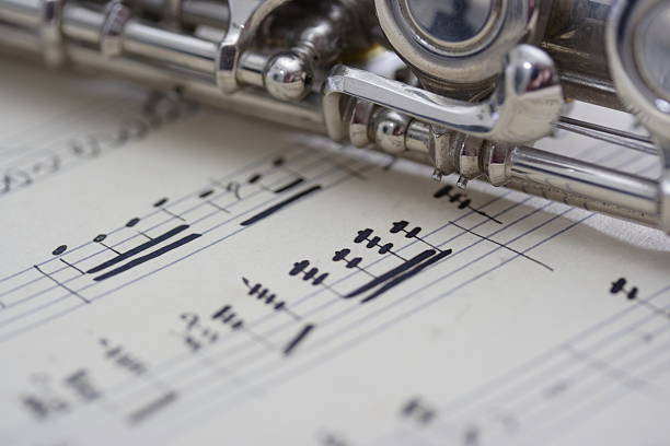 Flute and old sheet music stock photo