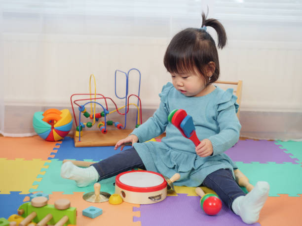 istock baby girl play clacker at home 918277220