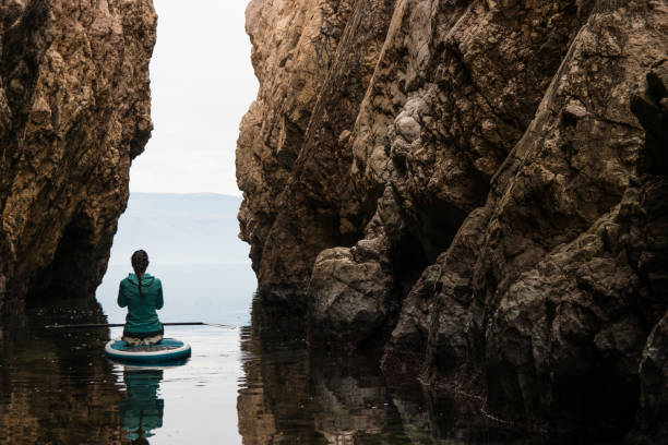 istock Yoga on stand up paddle board 918277536