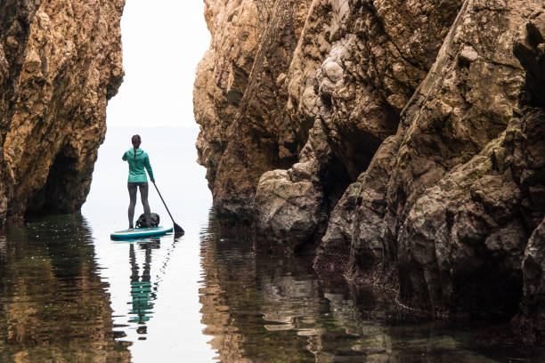 istock Young woman paddling towards the light 918277910