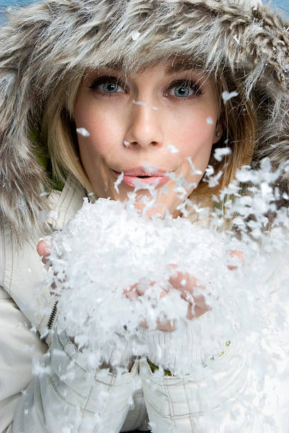 istock Girl blowing snow 91828090