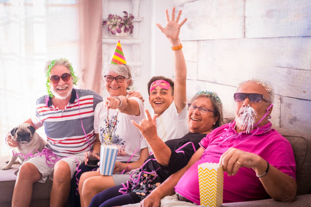 istock senior and young boy party at home 918283514