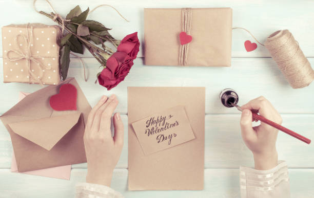 istock Valentine day theme. Top view of workplace for preparing handmade decorations. 918284392