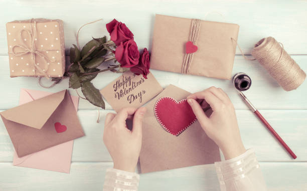istock Valentine day theme. Top view of workplace for preparing handmade decorations. 918284394