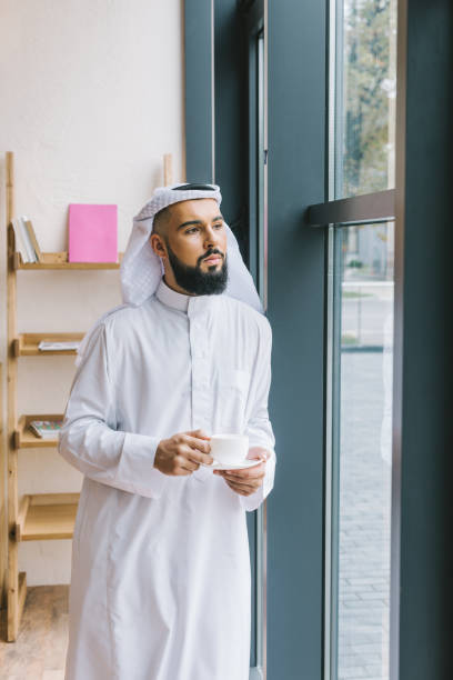 istock muslim man with cup of coffee 918284544