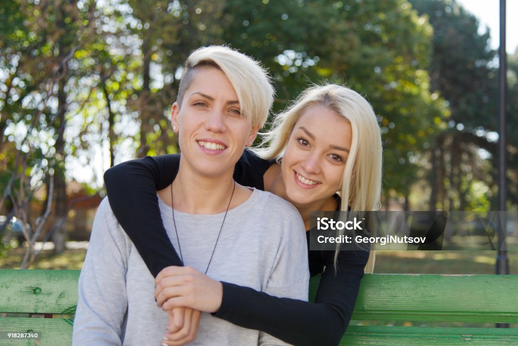 Two girlfriends in the park. Gay Person Stock Photo