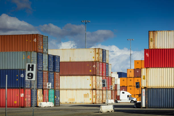istock Truck Driving Between Shipping Containers 918289970