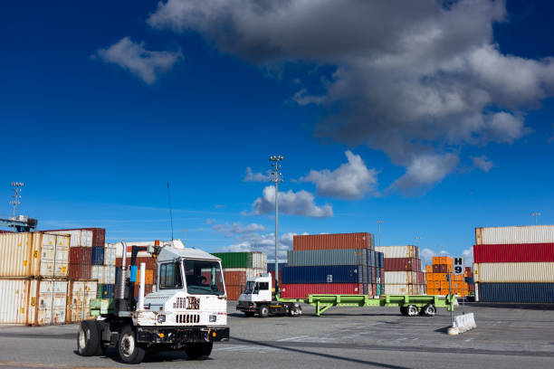 istock Utility Tractor Rigs in Shipping Terminal 918289996