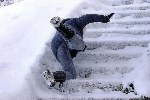 Photo of A woman slips and fell on a wintry staircase