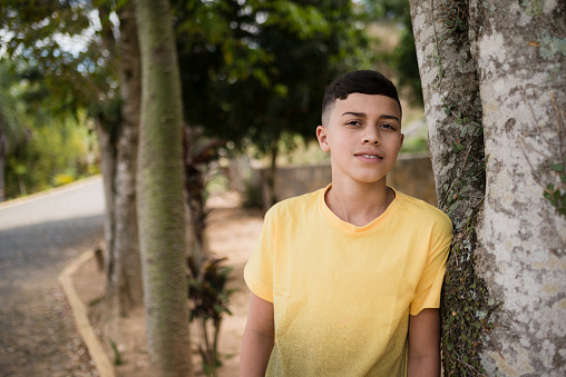 Portrait of brazilian Teenage boy in yellow shirt