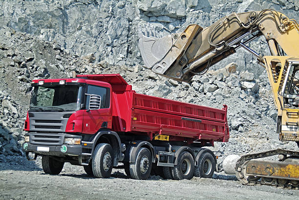 istock Dump Truck and Excavator in a Quarry 91829144