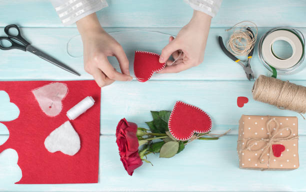istock Valentine day theme. Top view of workplace for preparing handmade decorations. 918292974