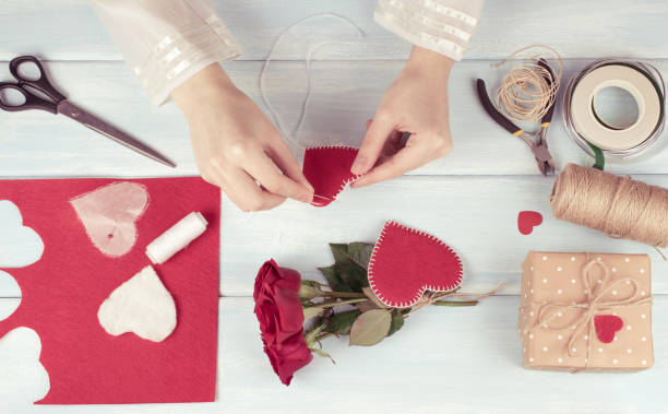 istock Valentine day theme. Top view of workplace for preparing handmade decorations. 918292998