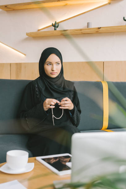istock muslim woman with prayer beads 918293608