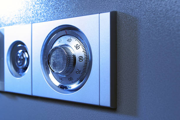 istock Closeup of a secure lock in a vault in blue tones. 918293896