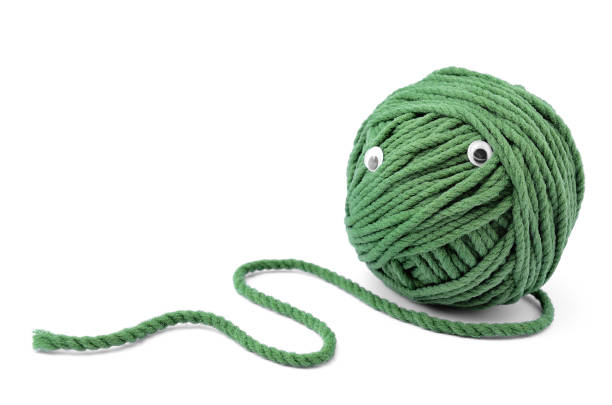 istock Clew of green thread for knitting isolated on white background 918294974