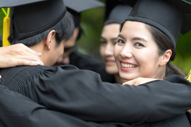 istock Happily graduates are celebrating graduation. 918297620
