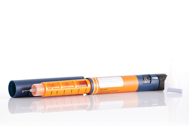 istock Close-up of orange and blue insulin pen 91829963