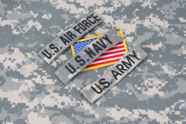 istock US military branch tapes whith US flag on camouflage uniform 918300570