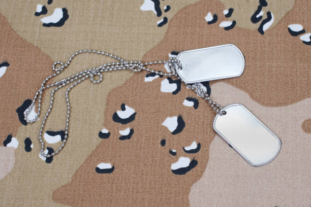 istock dog tags on us army camouflaged uniform 918300602