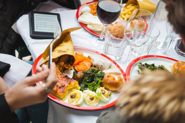 istock Brunch and mobile phones. Group of people texting while eating at restaurant 918305092