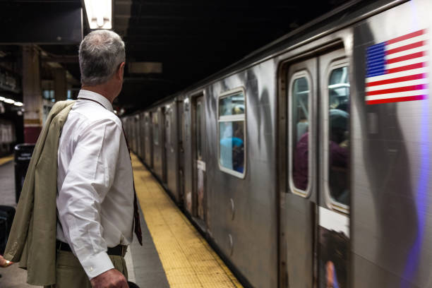 Senior businessman in New York subway