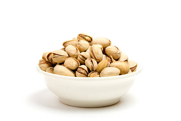 Pistachios with shell on white background stock photo