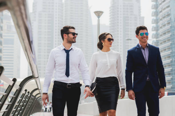 istock Group of business people walking talking. 918307406