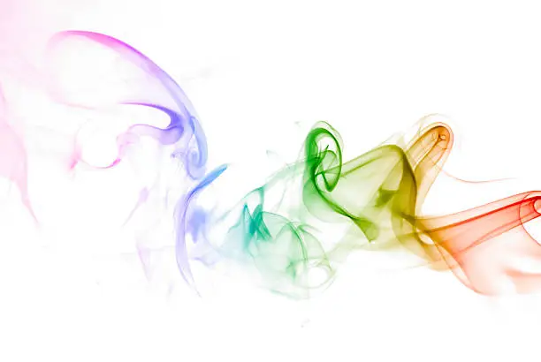 Photo of Multicolored smoke on a white background